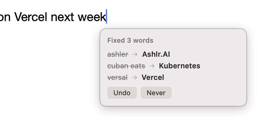 Lexicon’s correction bubble reading ‘Fixed 3 words’, listing ashler corrected to Ashlr.AI, cuban eats to Kubernetes and versal to Vercel, with Undo and Never buttons.